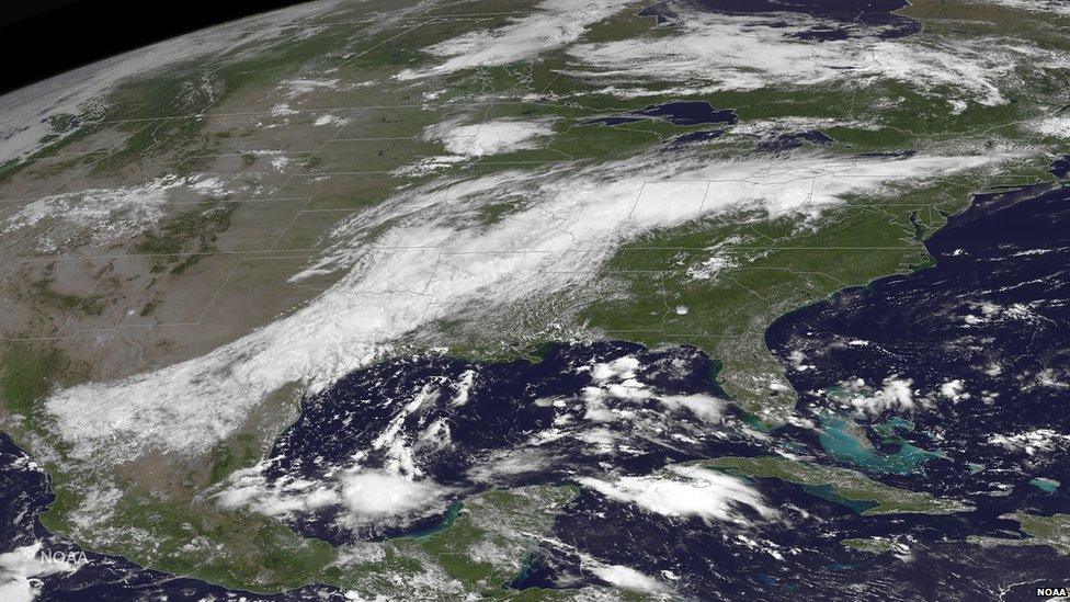 This satellite image from 15 August shows rain clouds over Louisiana and the adjacent states