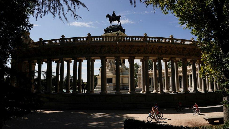 People ride bikes at Retiro Park on the day that Unesco added Madrid's historic Paseo del Prado boulevard and Retiro Park to its list of world heritage sites, in Madrid, Spain, 25 July 2021