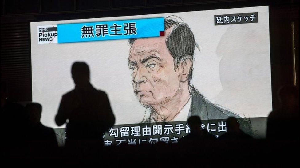 TV screen showing Carlos Ghosn