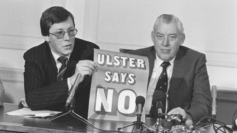 Peter Robinson and Ian Paisley holding 'Ulster Says No' poster