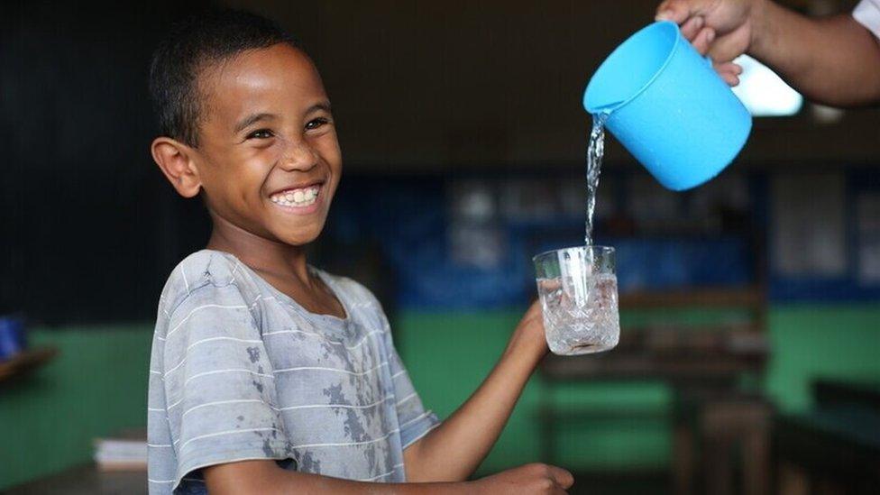 Tefy from Madagascar enjoying clean water