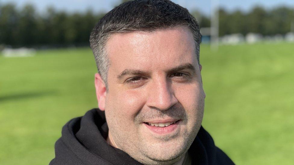 Man in field wearing a black hoodie at Northampton Balloon festival