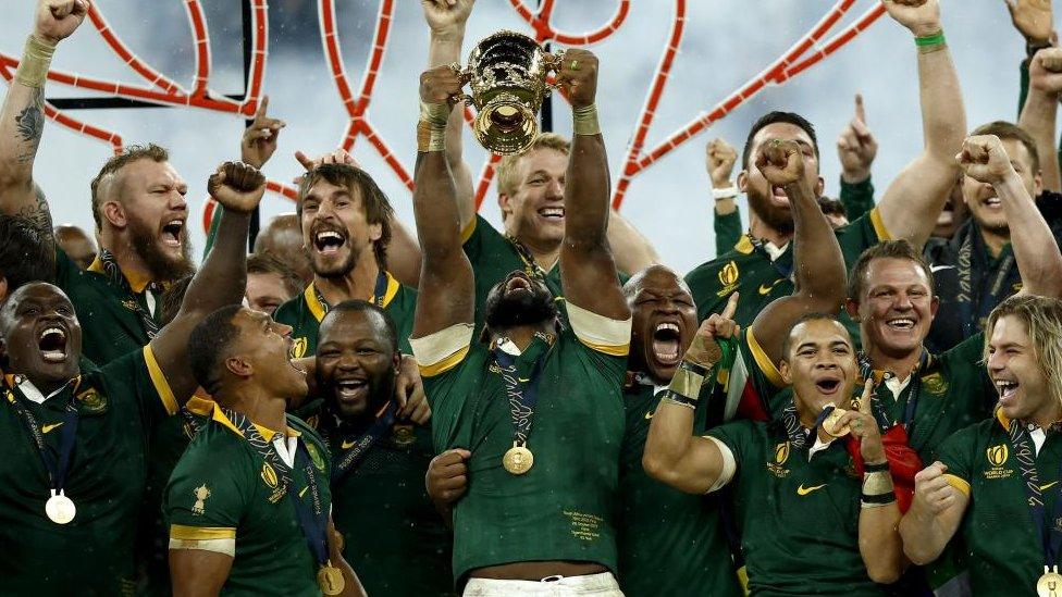 Springboks captain Siya Kolisi holds the World Cup above his head