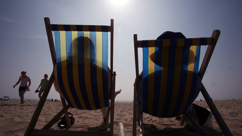 Sunbathers on chairs