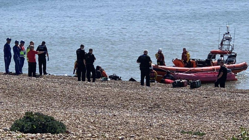 Migrants on Winchelsea Beach