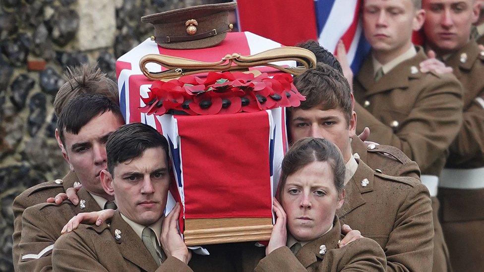 Coffins being carried