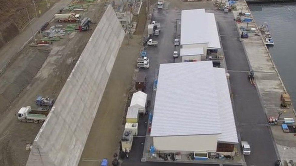 A new sea wall is being built in the waterfront area of Rikuzentakata