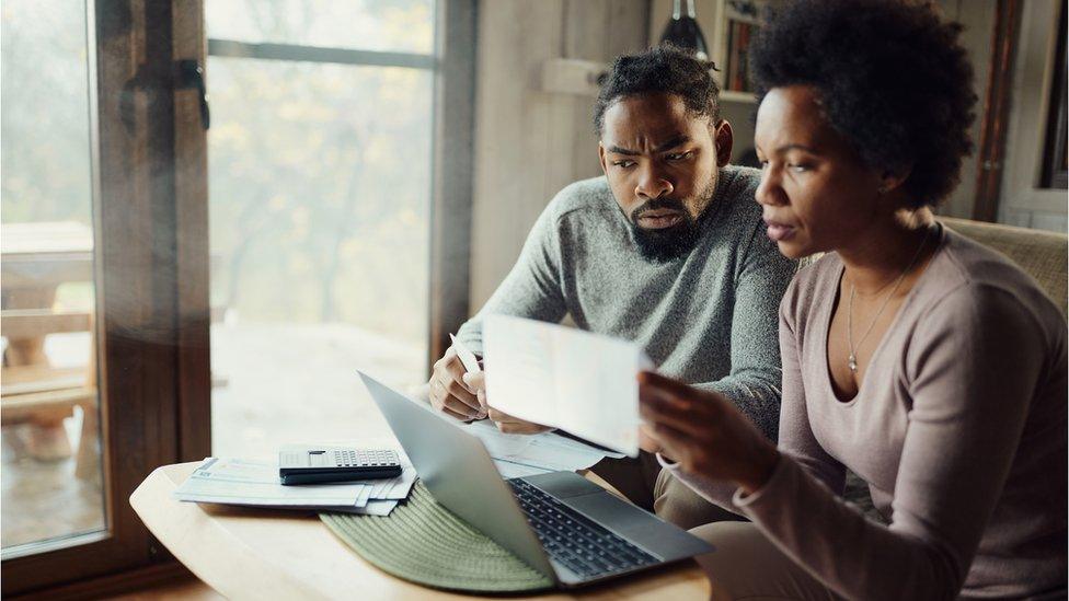 Couple looking at a bill