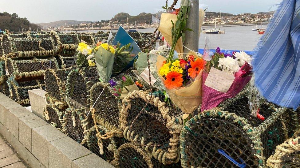 Floral tributes at Conwy quay