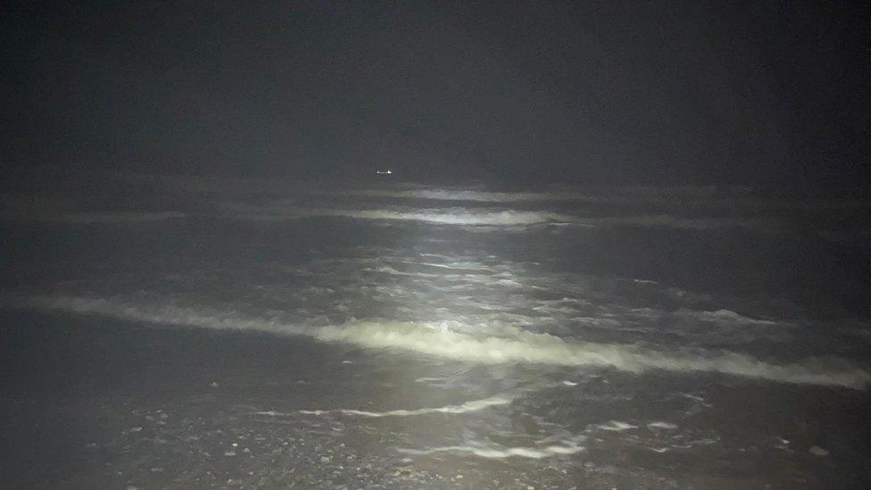 Footage showed how dark it was at the beach with only flashlights used to bring any light