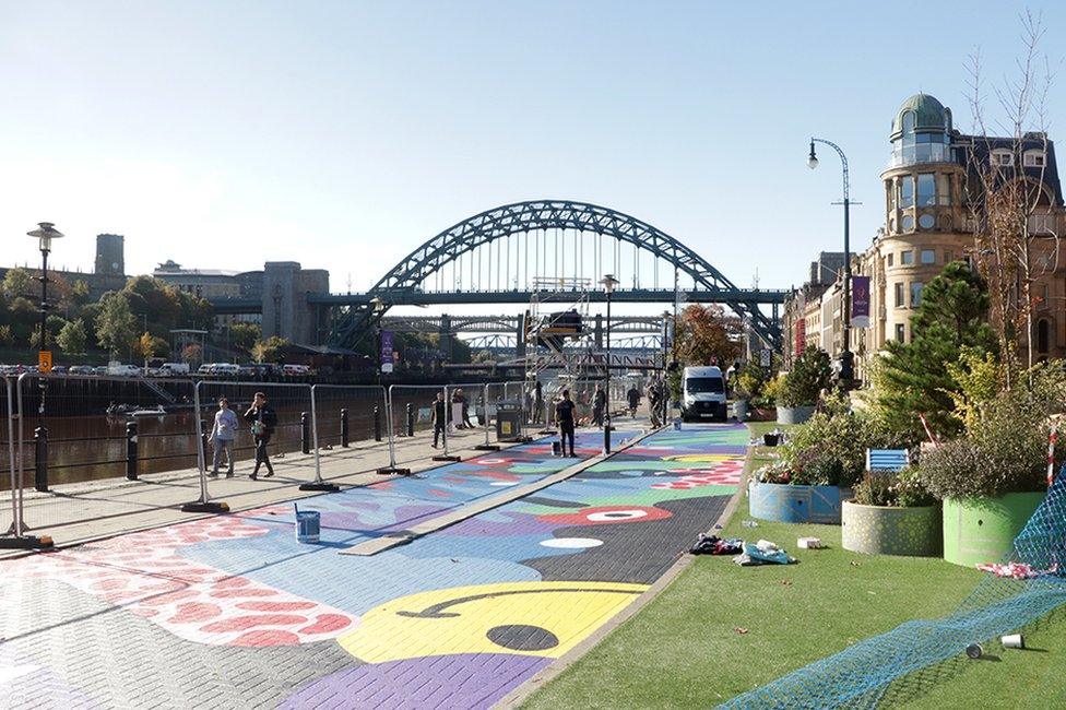 Mural on a disused bus lane on the Newcastle Quayside