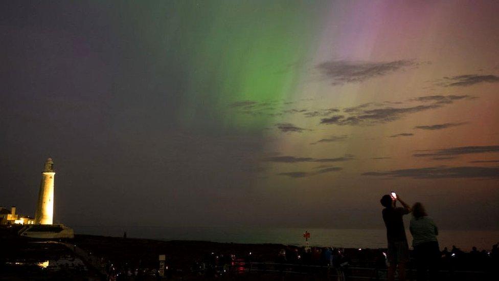 People visit St Mary's lighthouse in Whitley Bay to see the aurora borealis, commonly known as the northern lights