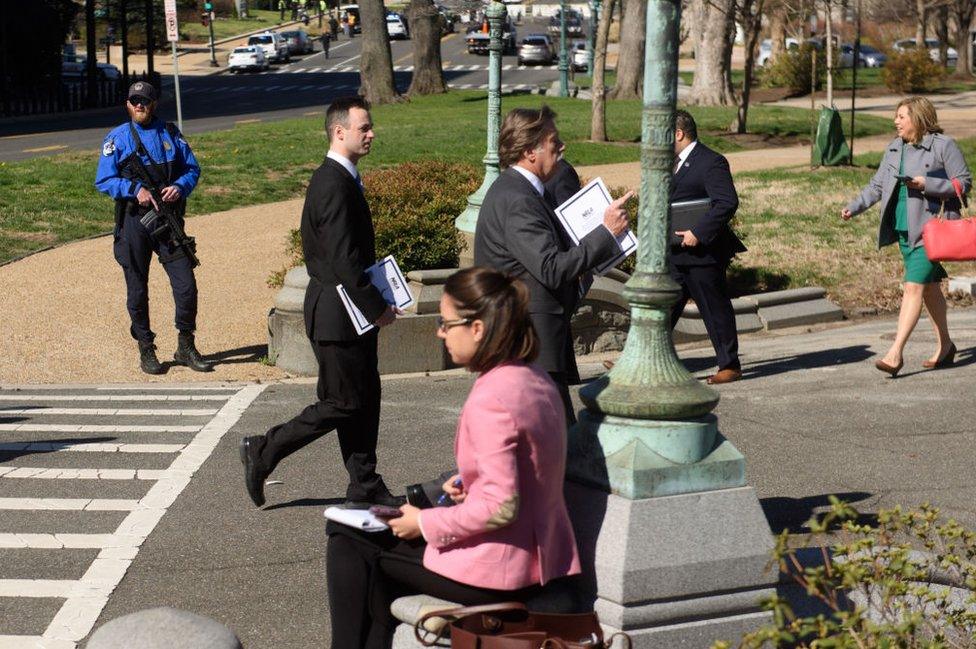 Police stand guard, as business continues as normal at the US Congress