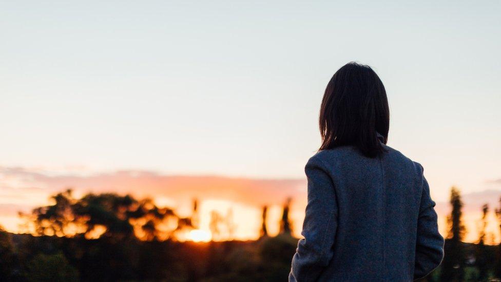 Stock image of a woman in silhouette