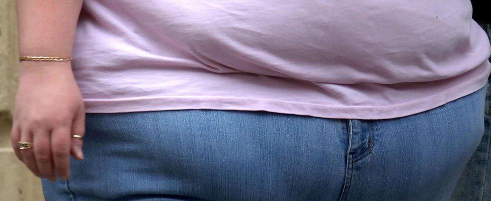 The waist of an obese woman