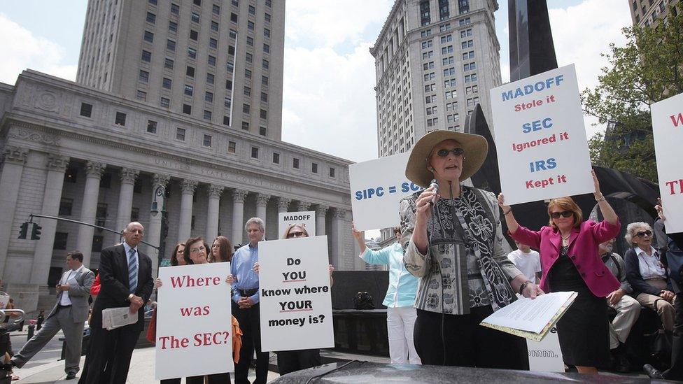 Bernard Madoff fraud victims hold a news conference following the sentencing hearing for Madofff, who was convicted for running a multibillion-dollar ponzi scheme, at Federal District Court in Manhattan on June 29, 2009 in New York City.