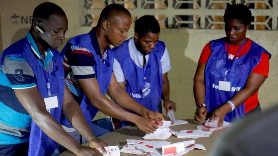 Polling staff start to count the ballots for the Liberian presidential election at a polling station in Monrovia, Liberia December 26, 2017