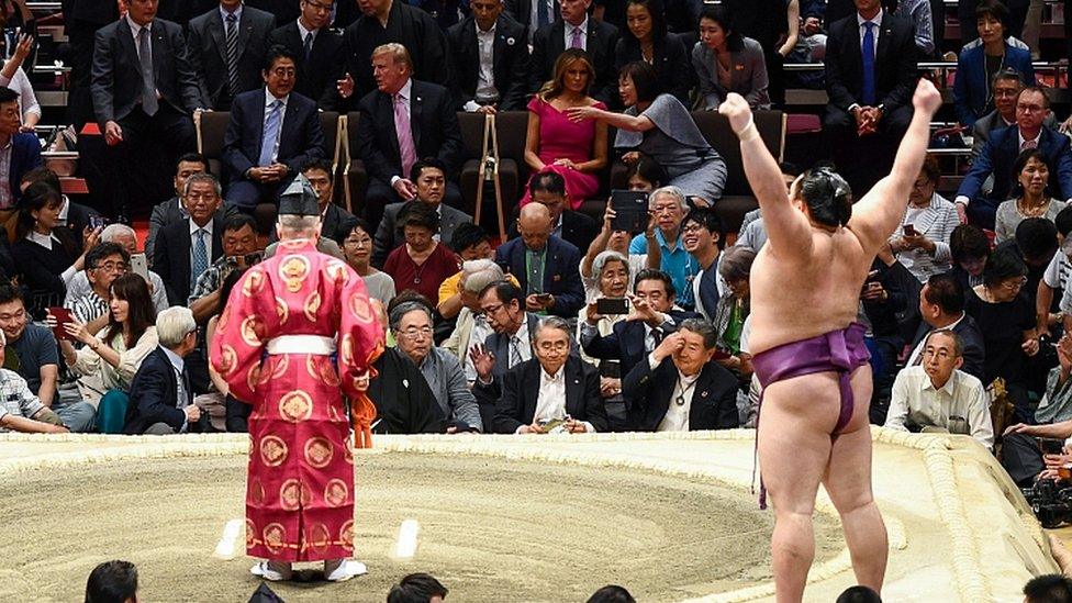 President Donald Trump watches a sumo battle during the Summer Grand Sumo Tournament in Tokyo on May 26, 2019