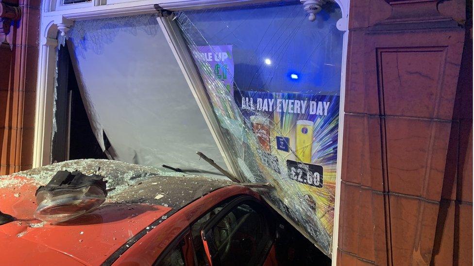 Car in collision with pub