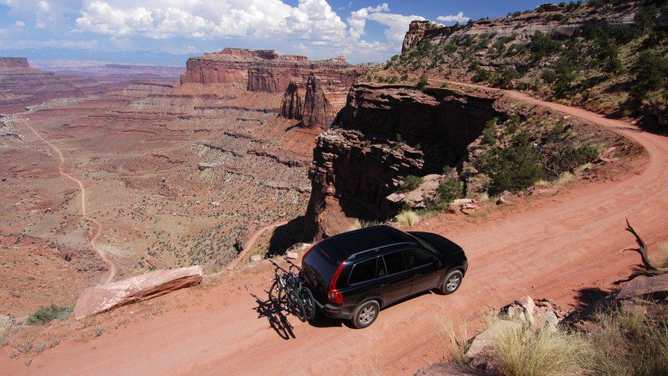 SUV driving along Grand Canyon road