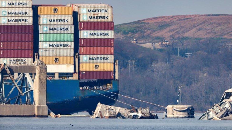 Wreckage from the Francis Scott Key Bridge surrounds the Dali cargo ship