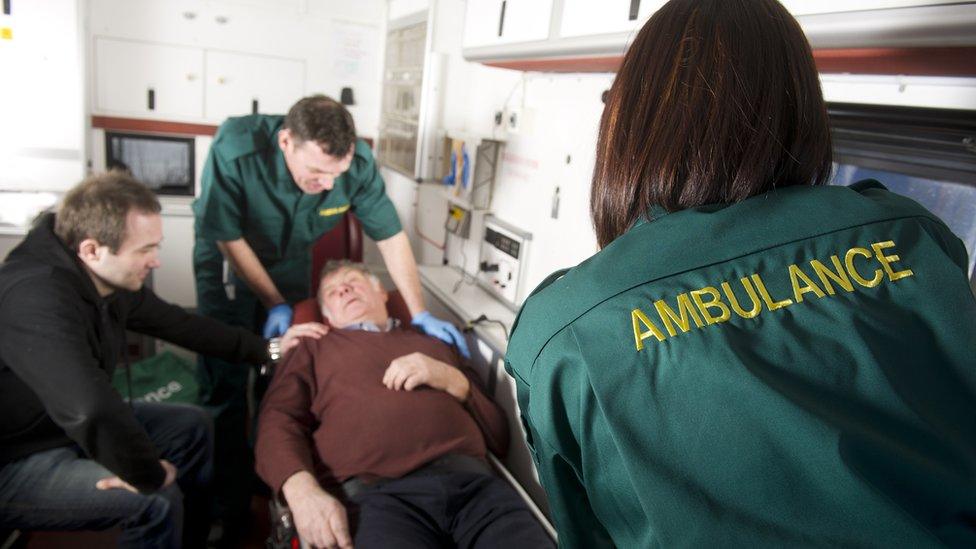 Ambulance crew with patient