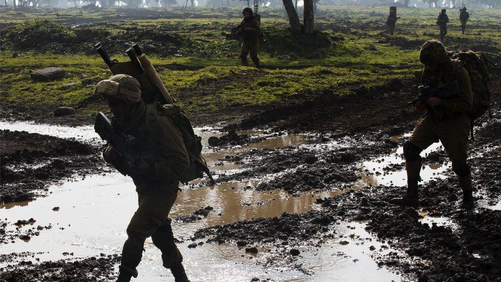 Israeli soldiers from the Golani Brigade take part in a military training exercise in the Israeli-annexed Golan Heights near the border with Syria on 19 January 2015.