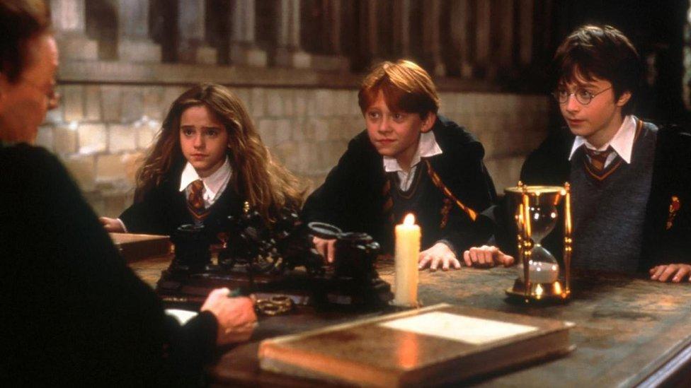 Emma Watson, Rupert Grint and Daniel Radcliffe as Hermione Granger, Ron Weasley and Harry Potter