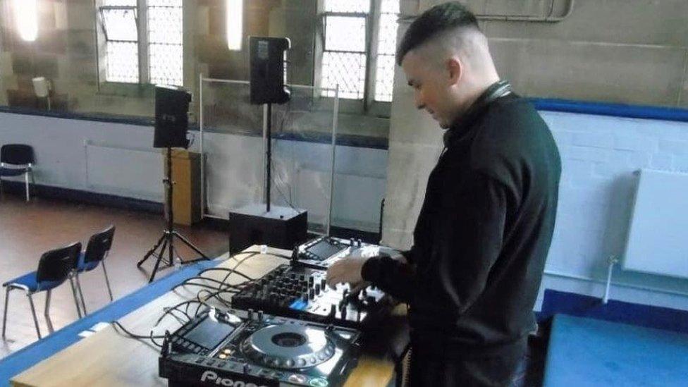 DJ Calvin Logue using a turntable