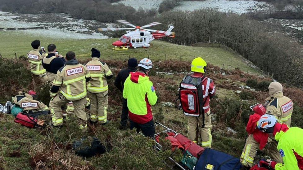 Rescuers and Coastguard helicopter