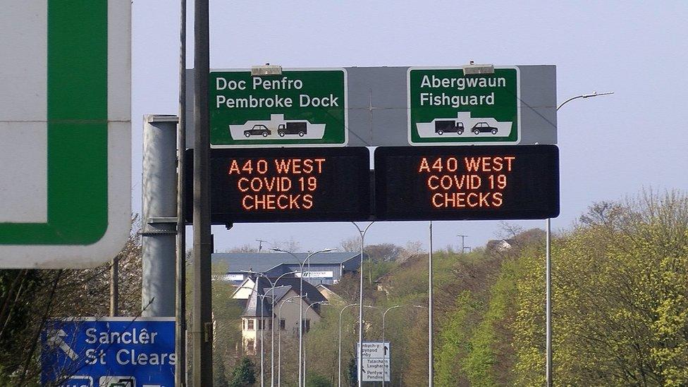 Signs on the A40 alerting drivers to Covid-19 checks