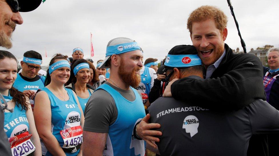 Prince Harry greets runners from the Head Together charity