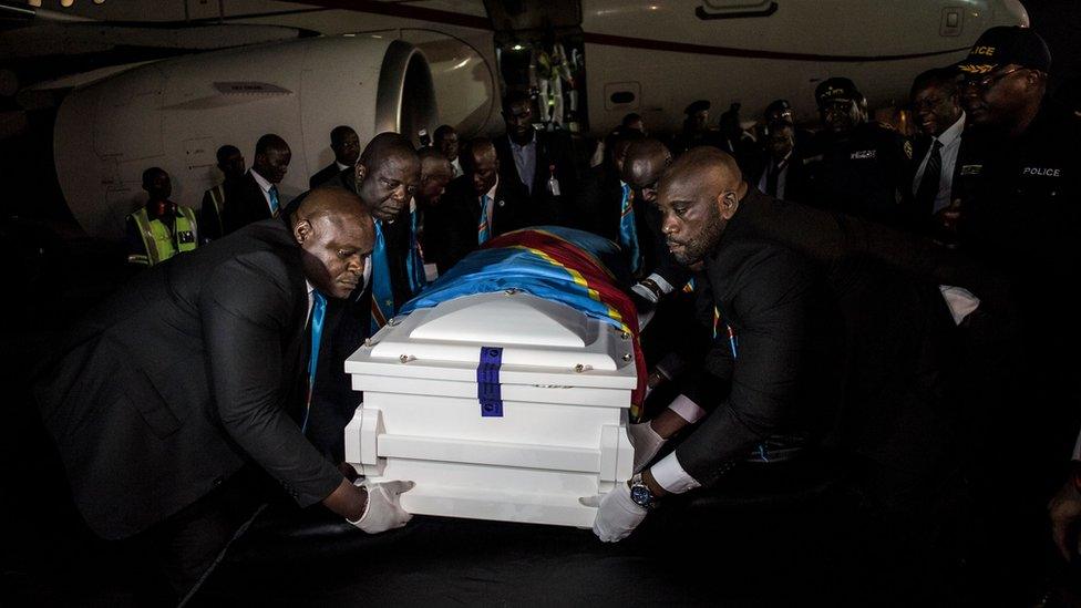 The coffin containing the remains of former Congolese Prime Minister and opposition leader Etienne Tshisekedi is unloaded from a plane