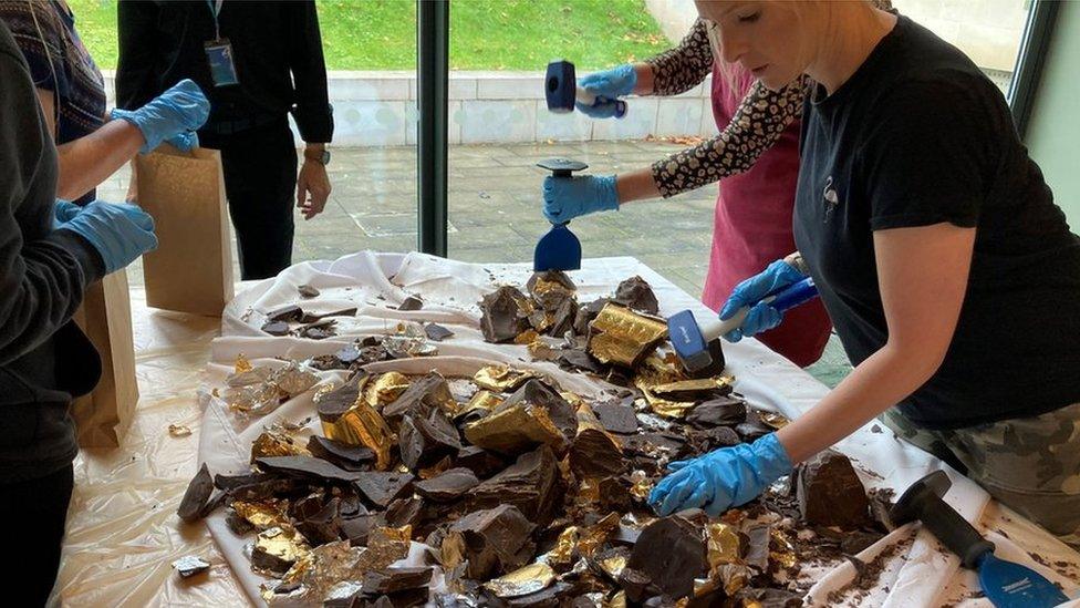 People smashing chocolate