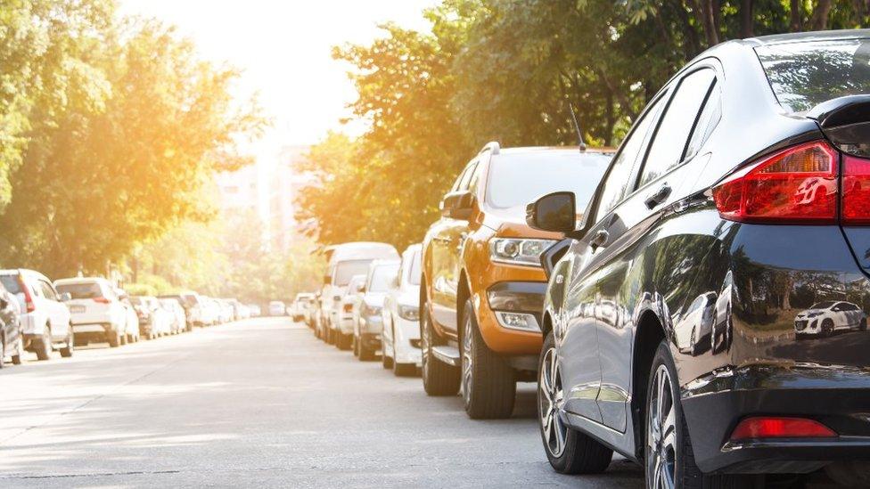 Cars parked in road