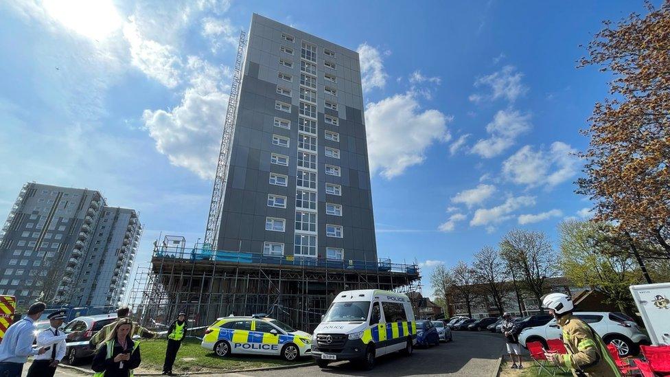 Emergency service workers outside flats that caught fire in Luton