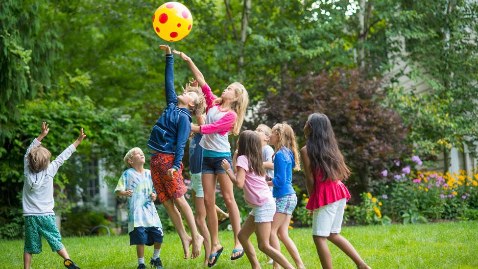 Children playing with a ball