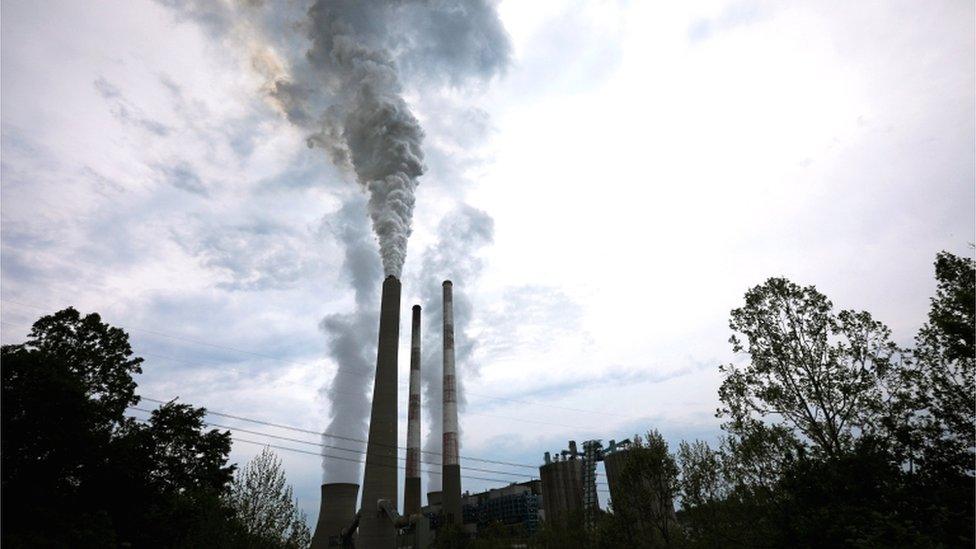 Exhaust rises from the stacks of the Harrison Power Station in Haywood, West Virginia