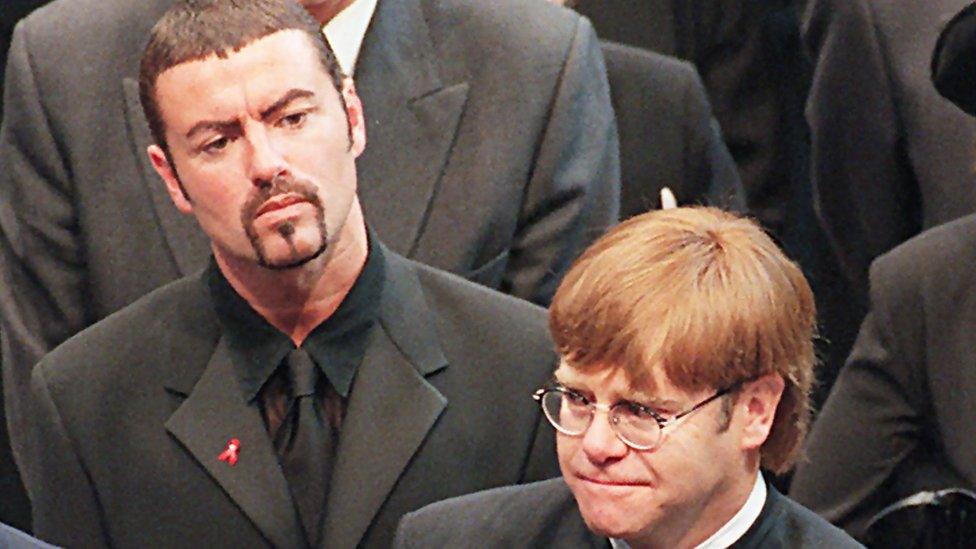 Pop stars George Michael (L) and Elton John (R) leaving Westminster Abbey following the funeral service of Diana, Princess of Wales, 6 September 1997