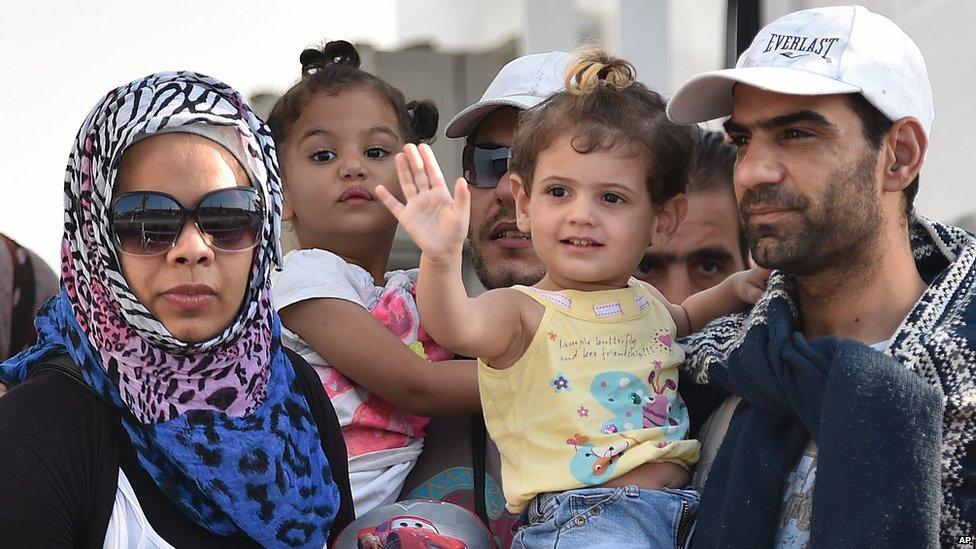 Migrants disembark from the Italian Coast Guard ship Fiorillo in the harbour of Pozzallo, near Ragusa, Sicily, Italy (7 August 2015)
