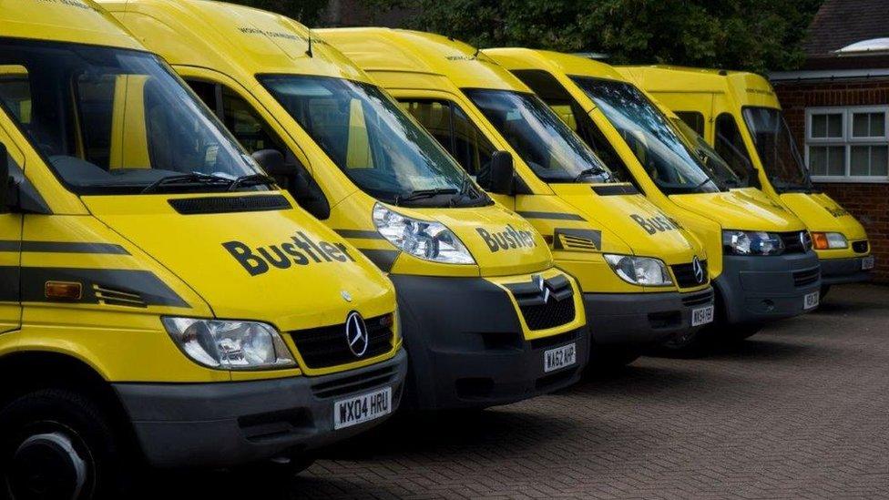 A row of Woking Community Transport buses