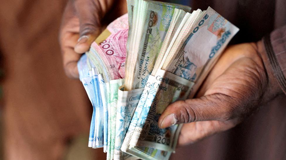 A man counting money in Nigeria