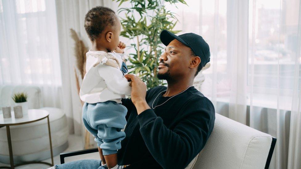 Father holding his baby