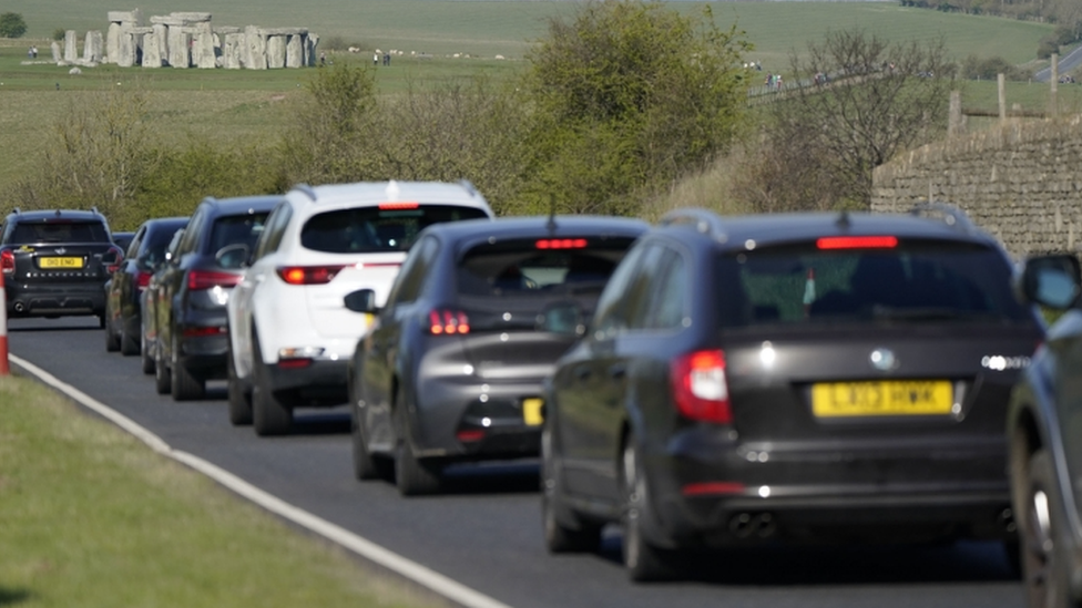 Cars make their way along the A303 past Stonehenge in Wiltshire during the Easter getaway