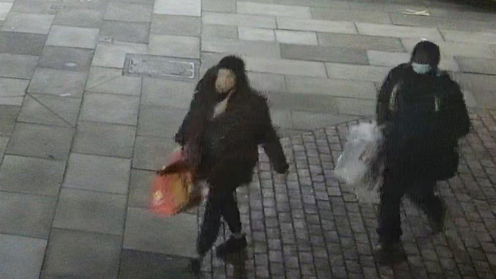 Mark Gordon and Constance Marten walking through Flower and Dean Walk near Brick Lane, East London, after dumping items including pushchair