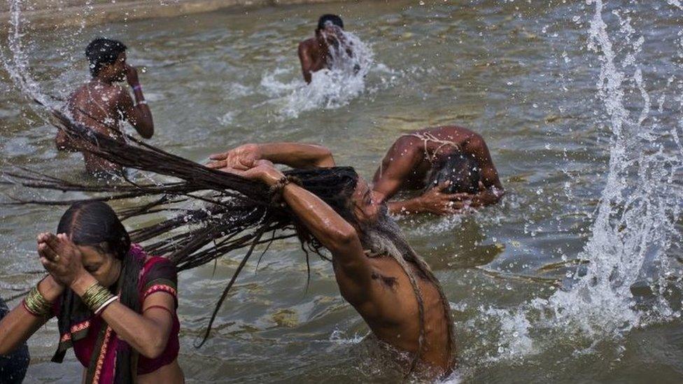 Hindu devotes take a bath in the Godavari River during Kumbh Mela, or Pitcher Festival, in Nasik, India, 29 August 2015