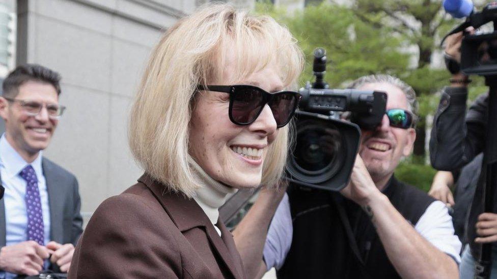 A close-up shot of E Jean Carroll leaving court past photographers