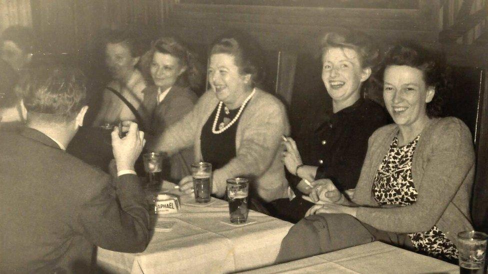 (Right to left) Selma van Gyseghem, Christina Helene Ardelheid Vermeirsch, Esther Vermeirsch and man (left with back to us) Albert van Gyseghem enjoying themselves at an unknown restaurant in Soho London in the early 1950's.