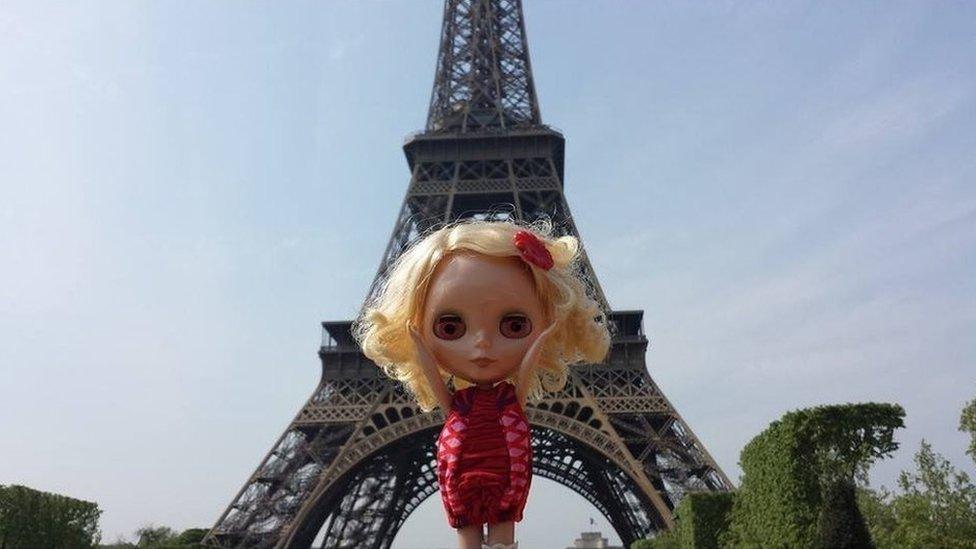 Blythe in front of the Eiffel Tower