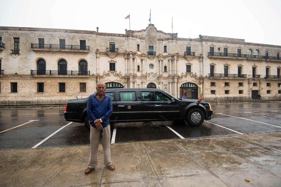 A Cuban security force member stands guard in front